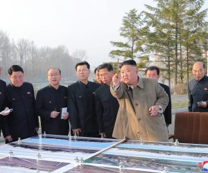 epa09098066 North Korean leader Kim Jong-un (front) inspects a site on which riverside terraced houses will be erected around the Pothong Gate in Pyongyang, North Korea, 25 March 2021 (issued 26 March 2021). Kim Jong-un did not oversee the launch of a new type of missile that North Korea conducted the same day.  EPA/KCNA EDITORIAL USE ONLY  EDITORIAL USE ONLY  EDITORIAL USE ONLY  EDITORIAL USE ONLY