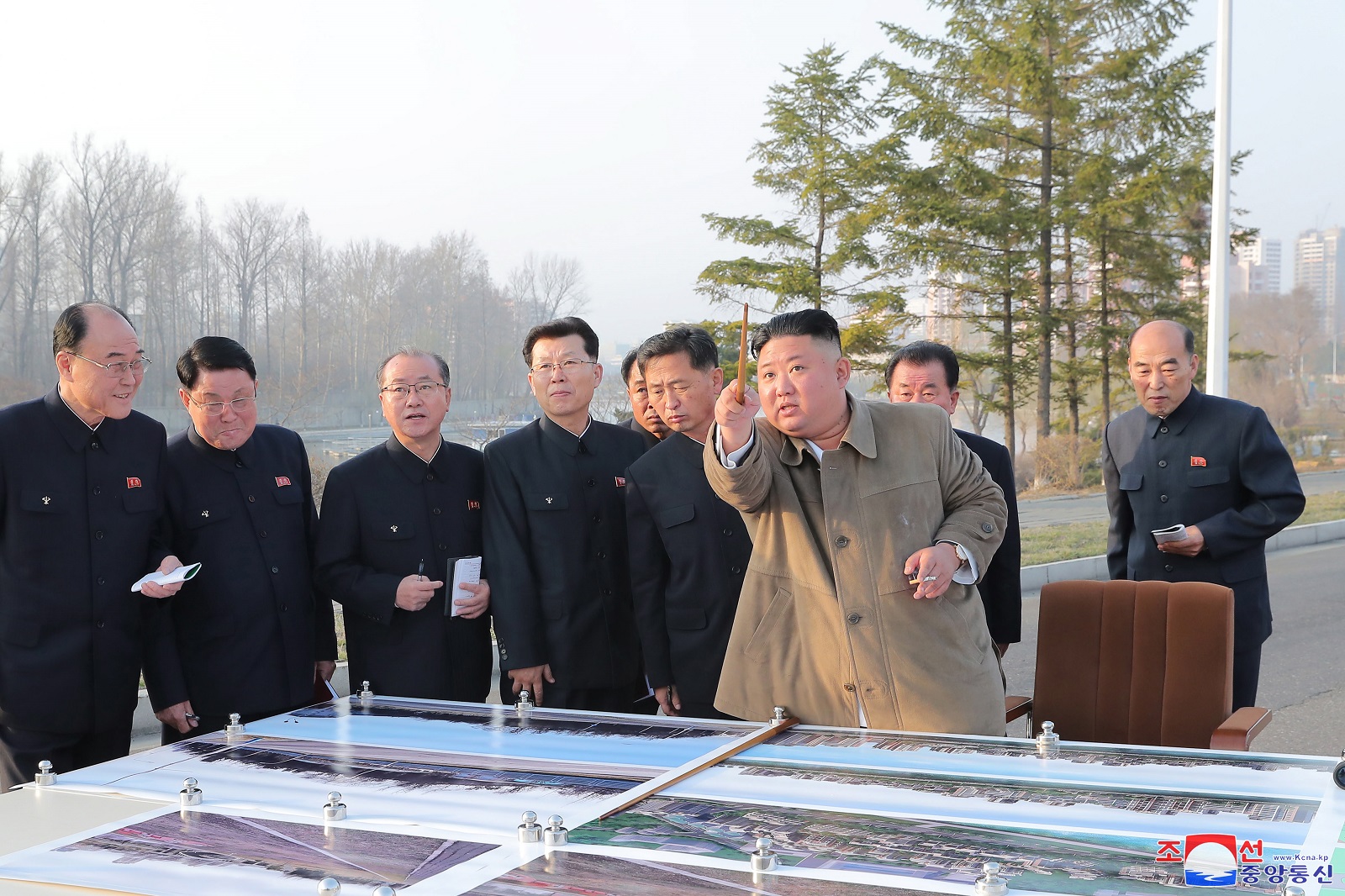 epa09098066 North Korean leader Kim Jong-un (front) inspects a site on which riverside terraced houses will be erected around the Pothong Gate in Pyongyang, North Korea, 25 March 2021 (issued 26 March 2021). Kim Jong-un did not oversee the launch of a new type of missile that North Korea conducted the same day.  EPA/KCNA EDITORIAL USE ONLY  EDITORIAL USE ONLY  EDITORIAL USE ONLY  EDITORIAL USE ONLY