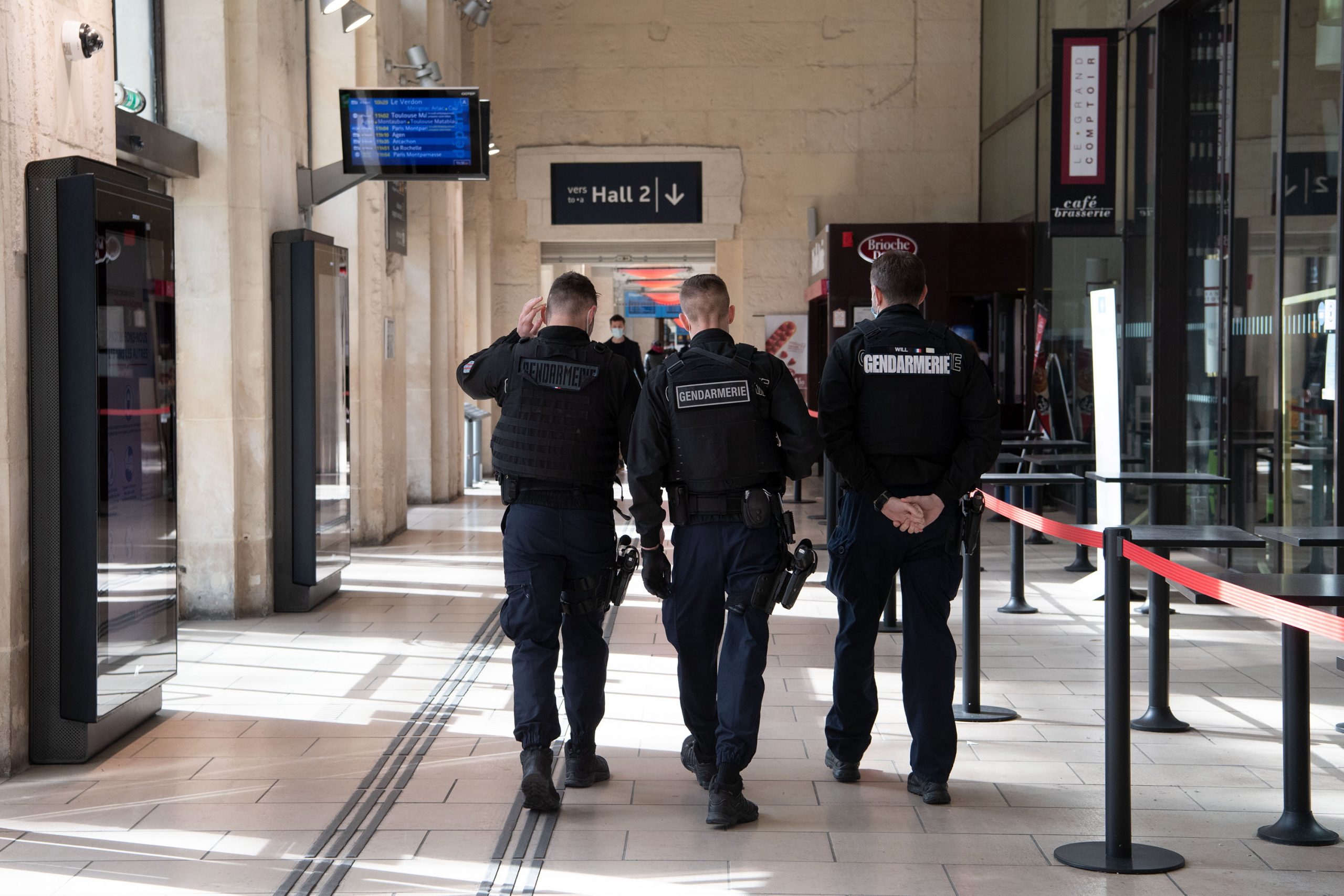 epa09101056 Policemen walk on the platform of Saint-Jean train station in Bordeaux, France, 27 March 2021. French Prime Minister Castex on March 18 announced additional lockdown restrictions in 16 regions of France as the country enters a third wave of the COVID-19 pandemic. With the new measures, more than 90,000 police and gendarmes mobilized for intensified controls in stations, airports and tolls while the health situation is critical with the third wave of coronavirus pandemic and the predominance of the British variant of the virus.  EPA/CAROLINE BLUMBERG