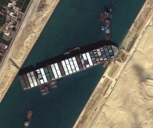 epa09101181 A handout satellite image made available by MAXAR Technologies shows multiple tug boats positioned alongside the 'Ever Given' and dredging operations in progress, in the Suez Canal, Egypt, 27 March 2021. The large container ship Ever Given ran aground in the Suez Canal on 23 March, blocking passage of other ships and causing a traffic jam for cargo vessels. The head of the Suez Canal Authority announced on 25 March that 'the navigation through the Suez Canal is temporarily suspended' until the floatation of the Ever Given is completed. Its floatation is being carried out by eight large tugboats that are towing and pushing the grounding vessel.  EPA/MAXAR TECHNOLOGIES HANDOUT -- MANDATORY CREDIT: SATELLITE IMAGE 2020 MAXAR TECHNOLOGIES -- the watermark may not be removed/cropped -- HANDOUT EDITORIAL USE ONLY/NO SALES HANDOUT EDITORIAL USE ONLY/NO SALES