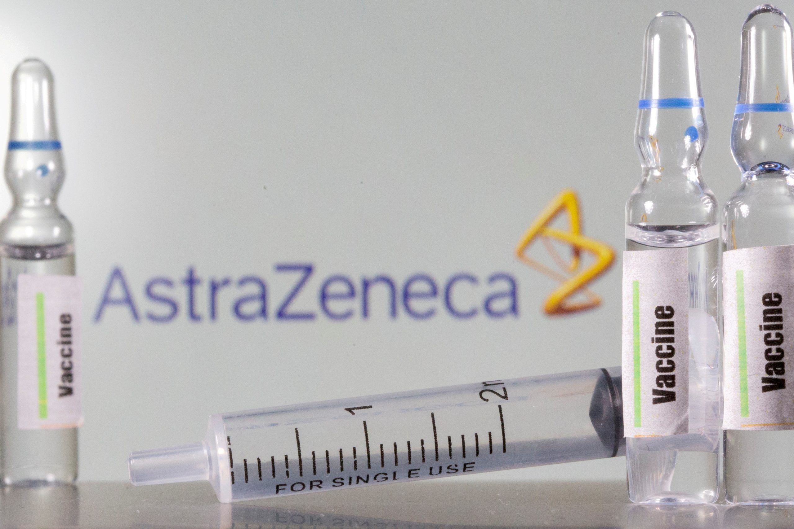 FILE PHOTO: A test tube labelled with the Vaccine is seen in front of an AstraZeneca logo in this illustration FILE PHOTO: A test tube labelled "vaccine" in front of an AstraZeneca logo in this illustration taken, September 9, 2020. REUTERS/Dado Ruvic/Illustration/File Photo/File Photo/File Photo DADO RUVIC
