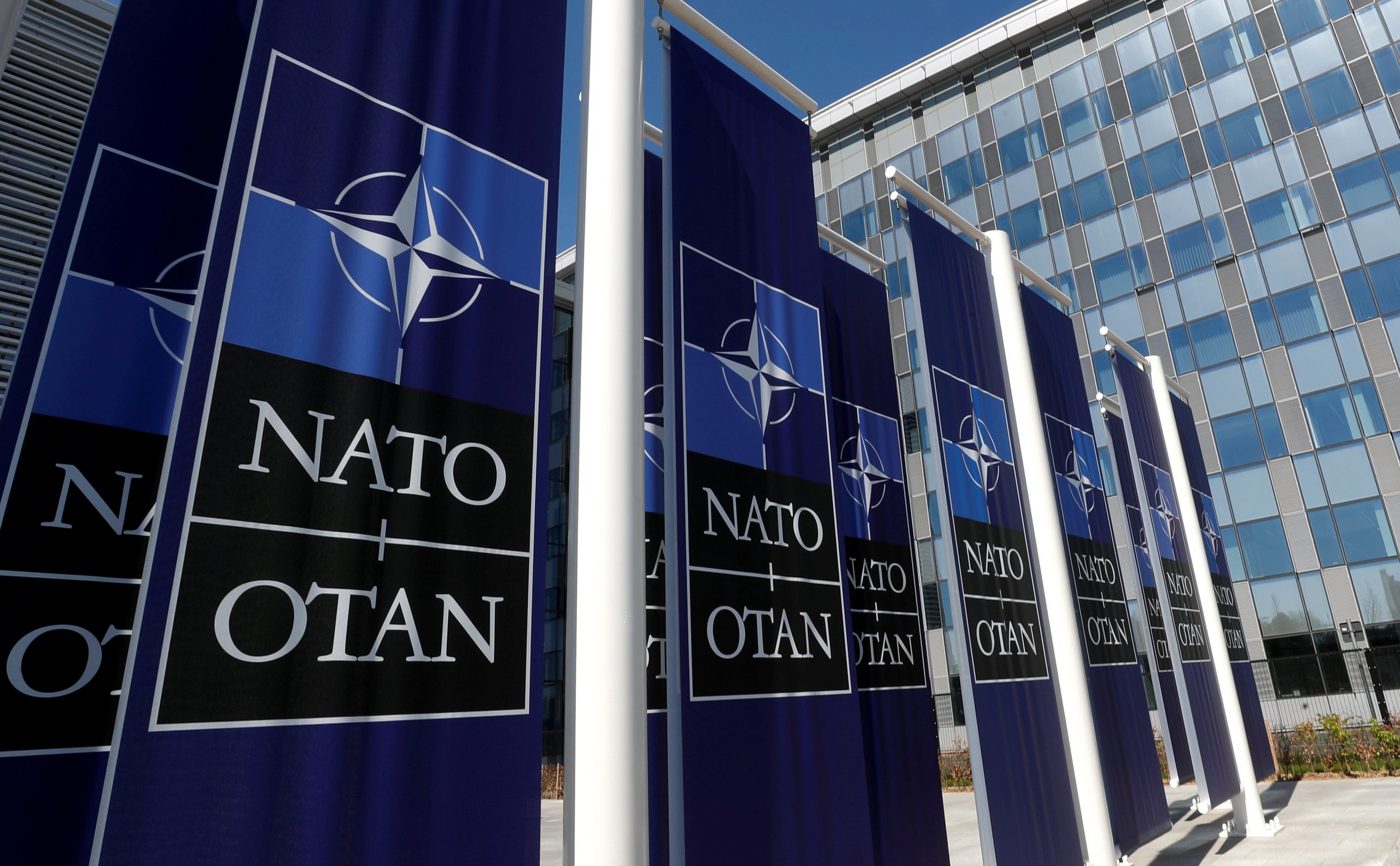 FILE PHOTO: Banners displaying the NATO logo are placed at the entrance of new NATO headquarters during the move to the new building FILE PHOTO: Banners displaying the NATO logo are placed at the entrance of new NATO headquarters during the move to the new building, in Brussels, Belgium April 19, 2018.  REUTERS/Yves Herman/File Photo YVES HERMAN
