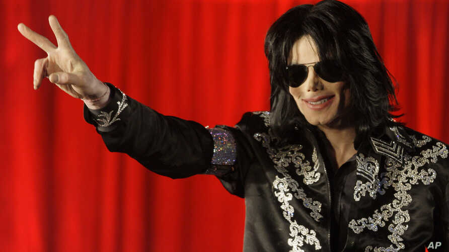 ** FILE ** In this March 5, 2009 file photo US singer Michael Jackson announces that he is set to play ten live concerts at the London O2 Arena in July, which he announced at a press conference at the London O2 Arena. A federal judge ruled in favor of Jacksons estate Friday Aug. 10, 2012 that a businessman who operated a website using the likeness and some of the singers works had infringed copyrights and should be blocked from future usage of the material. (AP Photo/Joel Ryan, File)