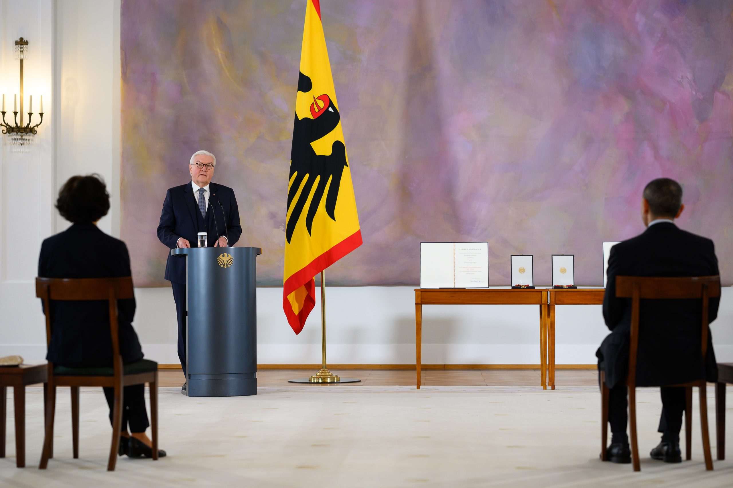 epa09083512 German President Frank-Walter Steinmeier (2-L) awards Ugur Sahin (R) and his wife Oezlem Tuereci (L), founders of the vaccine developer BioNTech, the Grand Cross of Merit with Star of the Order of Merit of the Federal Republic of Germany, at Bellevue Palace in Berlin, Germany, 19 March 2021. The couple is being honored for their tireless efforts in the field of mRNA technology research. Within a very short time, they succeeded in developing and obtaining approval for a vaccine against Covid-19, thus making a decisive contribution to containing the pandemic.  EPA/Bernd von Jutrczenka / POOL