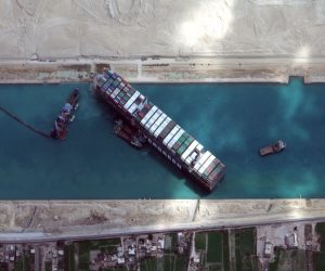epa09103099 A handout satellite image made available by MAXAR Technologies shows excavation around the bow of the 'Ever Given' and dredging operations in progress, in the Suez Canal, Egypt, 28 March 2021. The large container ship Ever Given ran aground in the Suez Canal on 23 March, blocking passage of other ships and causing a traffic jam for cargo vessels.  EPA/MAXAR TECHNOLOGIES HANDOUT MANDATORY CREDIT: SATELLITE IMAGE 2020 MAXAR TECHNOLOGIES -- the watermark may not be removed/cropped -- HANDOUT EDITORIAL USE ONLY/NO SALES
