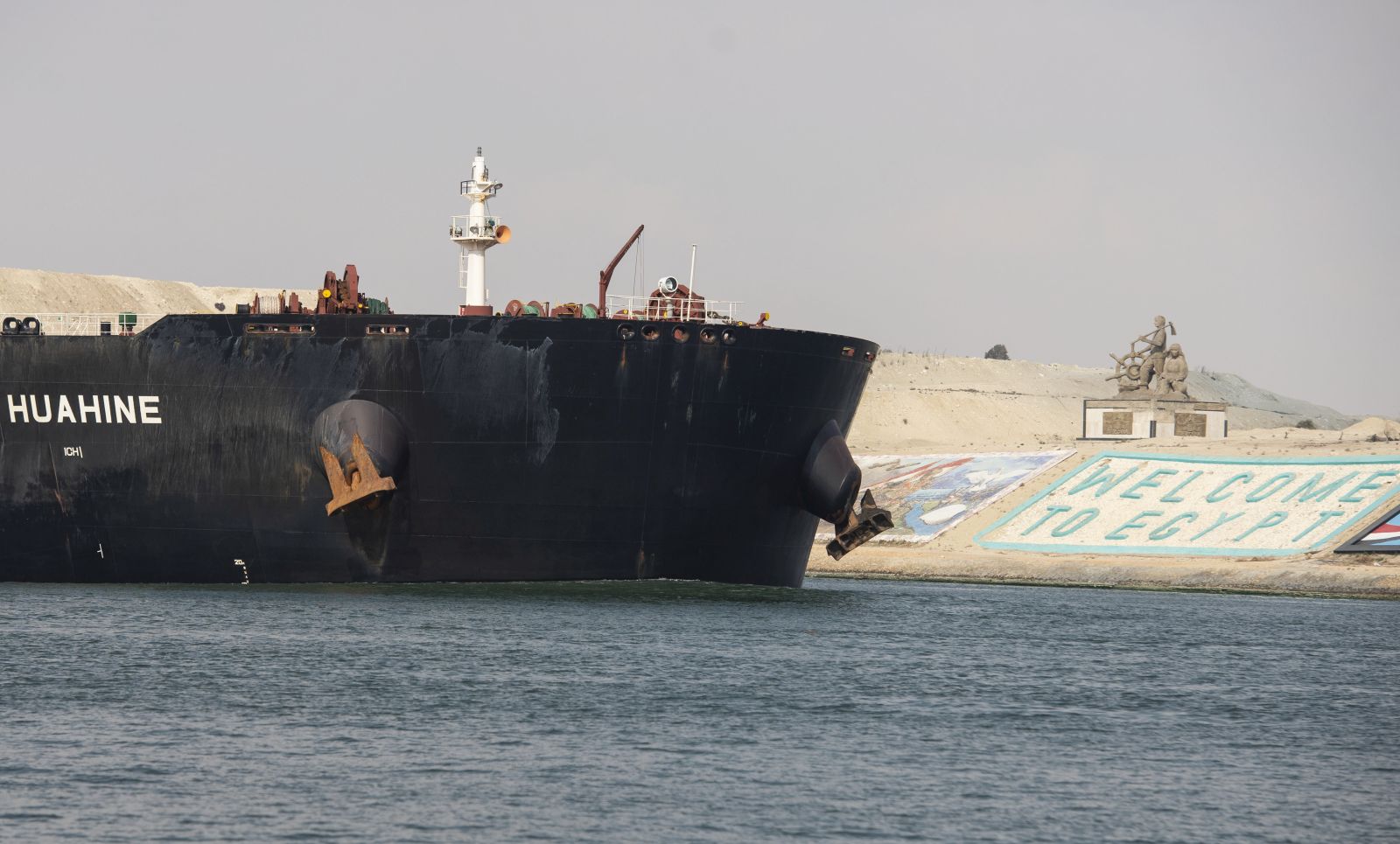 epa09106700 A view of a ship as it starts moving in the Suez Canal, in Ismalia, Egypt, 30 March 2021. The Suez Canal Authority on 29 March said that traffic is to resume after the large container ship 'Ever Given' was refloated and 43 vessels had resumed transit so far from the Great Bitter Lake, which separates two sections of the canal. The Ever Given ran aground in the Suez Canal on 23 March, causing a huge traffic backlog of ships.  EPA/Mohamed Hossam