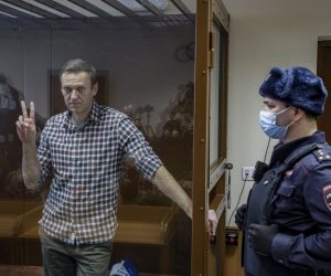 epa09108968 (FILE) Russian opposition leader Alexei Navalny gestures inside a glass cage prior to a hearing at the Babushkinsky District Court in Moscow, Russia, 20 February 2021 (reissued 31 March 2021). Russian opposition leader Alexei Navalny, who serves his 2,5 years sentence in a prison colony in the town of Pokrov in the Vladimir region, announced he is going on hunger strike in a protest of mistreatment in the prison.  EPA/YURI KOCHETKOV *** Local Caption *** 56711412