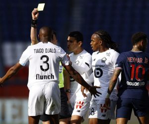 epa09113653 Tiago Djalo of Lille OSC is booked during the French Ligue 1 soccer match between Paris Saint German and Lille OSC, in Paris, France, 03 April 2021.  EPA/IAN LANGSDON