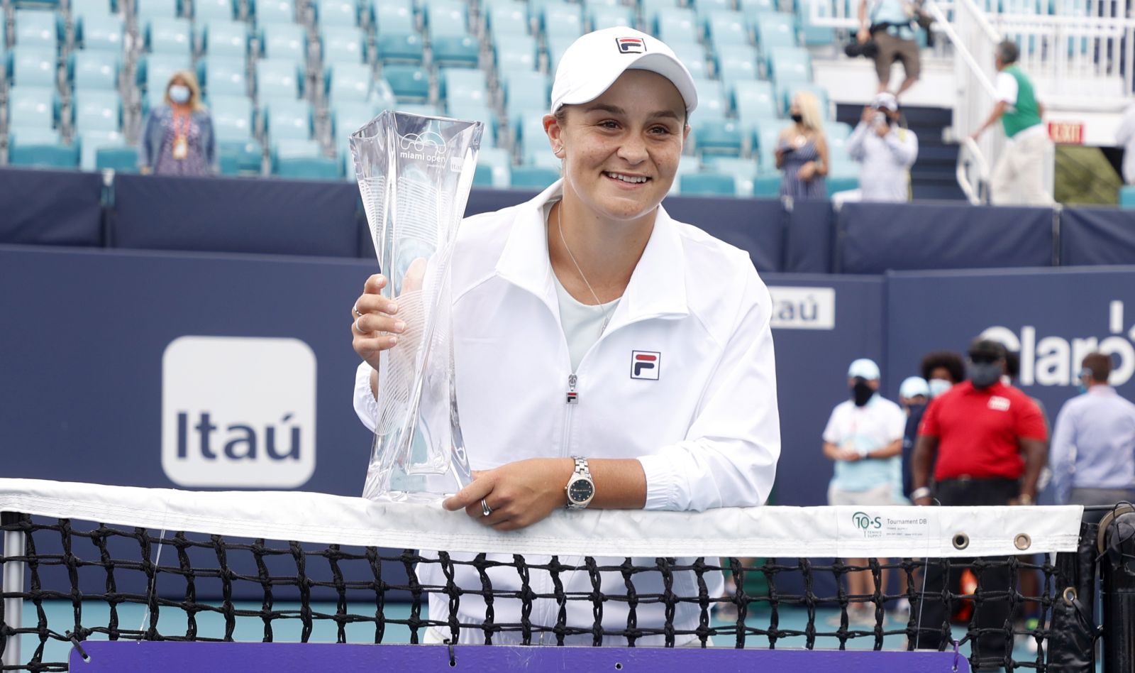 epa09114306 Ashleigh Barty of Australia holds the Butch Buchholz Trophy following her win against Bianca Andreescu of Canada following their Women's singles finals match at the Miami Open tennis tournament in Miami Gardens, Florida, USA, 03 April 2021.  EPA/RHONA WISE
