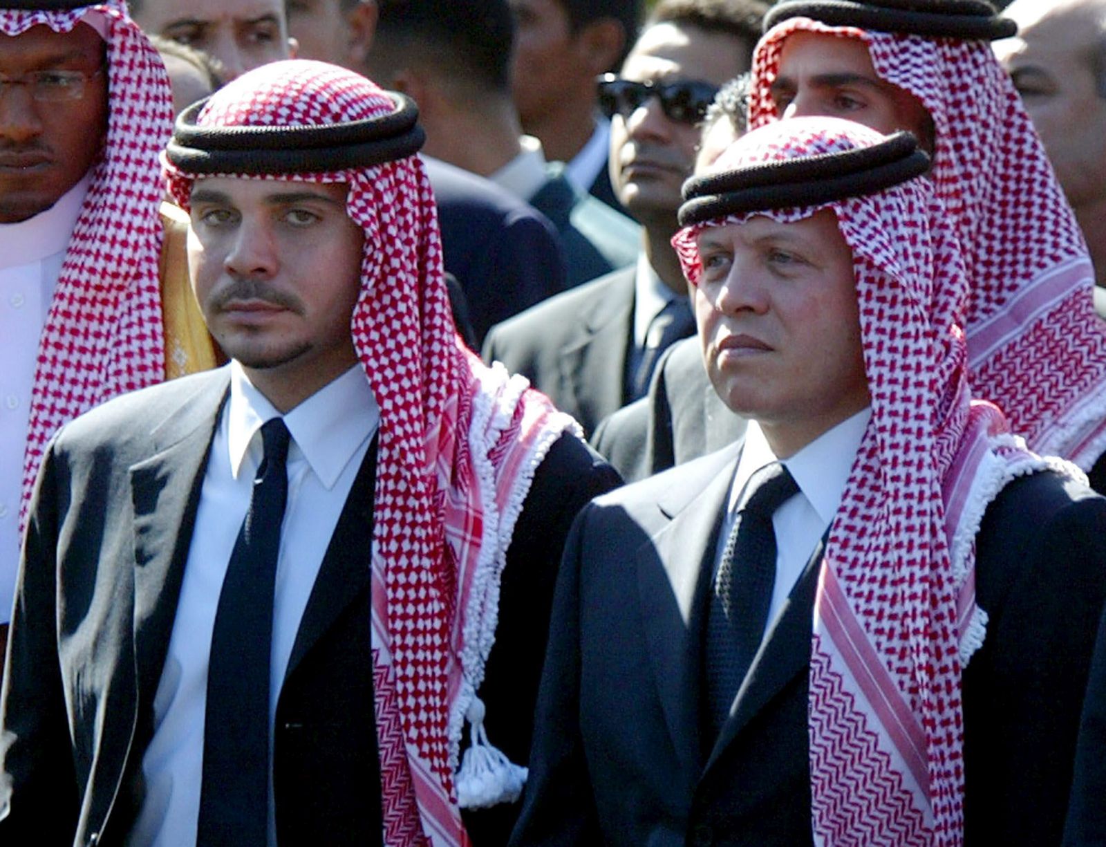 epa09116137 (FILE) - Former Jordanian Crown Prince Hamzah bin Al Hussein (L) with his half brother King Abullah of Jordan (R) as they walk together in the funeral procession of Palestinian President Yasser Arafat in Cairo, Egypt, 12 November 2004 (reissued on 04 April 2021), a day after several senior figures were detained and the half-brother of King Abdullah II prince Hamzah bin Hussein said that he was put under house arrest. Security agencies, through long-term and comprehensive joint investigations have been following activities and movements by His Royal Highness Prince Hamzah bin Al Hussein and others, said Deputy Prime Minister and Minister of Foreign Affairs and Expatriates Ayman Safadi in a press conference on 04 April.  EPA/MIKE NELSON *** Local Caption *** 00320818