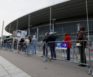 epa09118077 People arrive to be vaccinated against Covid-19 at a vaccination centre set up at the Stade de France (France's Stadium), in Saint-Denis, outside Paris, France, 06 April 2021. New restrictions have been implemented in France, including a brief closure of schools, to keep Covid-19 cases down before the effects of the vaccine drive kick in.  EPA/THOMAS SAMSON / POOL  MAXPPP OUT