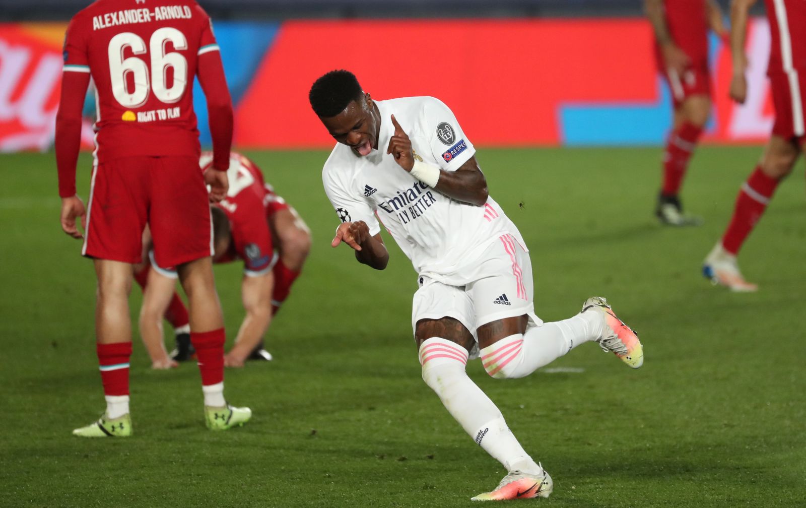 epa09119377 Real Madrid's striker Vinicius Jr celebrates after scoring the 3-1 goal during the UEFA Champions League quarter final first leg soccer match between Real Madrid and Liverpool FC held at Alfredo Di Stefano stadium, in Madrid, central Spain, 06 April 2021.  EPA/Kiko Huesca