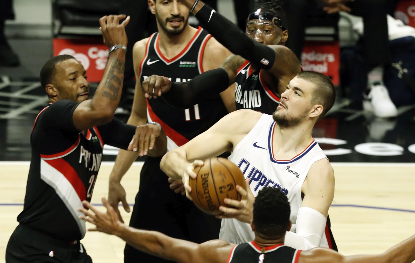 epa09119710 LA Clippers center Ivica Zubac (R) in action during the NBA basketball game between Portland Trail Blazers and Los Angeles Clippers at the Staples Center in Los Angeles, California, USA, 06 April 2021.  EPA/ETIENNE LAURENT SHUTTERSTOCK OUT