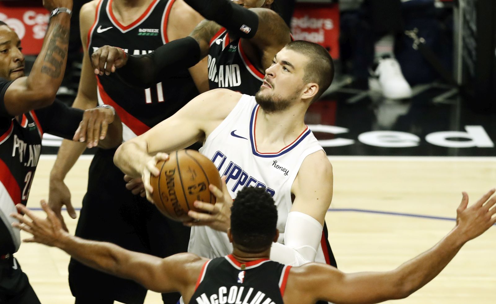 epa09119710 LA Clippers center Ivica Zubac (R) in action during the NBA basketball game between Portland Trail Blazers and Los Angeles Clippers at the Staples Center in Los Angeles, California, USA, 06 April 2021.  EPA/ETIENNE LAURENT SHUTTERSTOCK OUT
