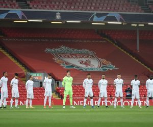 epa09135571 Real Madrid players observe a minute of silence to mark the 32nd anniversary of the Hillsborough disaster ahead the UEFA Champions League quarter final, second leg soccer match between Liverpool FC and Real Madrid at Anfield in Liverpool, Britain, 14 April 2021.  EPA/Peter Powell