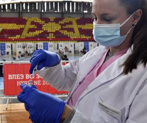 epa09136824 A nurse prepares the Russian Sputnik V vaccine against coronavirus disease (COVID-19) during vaccination at the Arena 'Boris Trajkovski' in Skopje, Republic of North Macedonia, 15 April 2021. North Macedonia continue COVID-19 vaccination campaign of elderly people with Russian Sputnik V vaccine. The numbers of newly infected and deaths from coronavirus remains high despite strict government measures to prevent the spread of pandemic. Vaccination is ongoing but North Macedonia is still unable to provide sufficient numbers of vaccines for mass vaccination.  EPA/GEORGI LICOVSKI