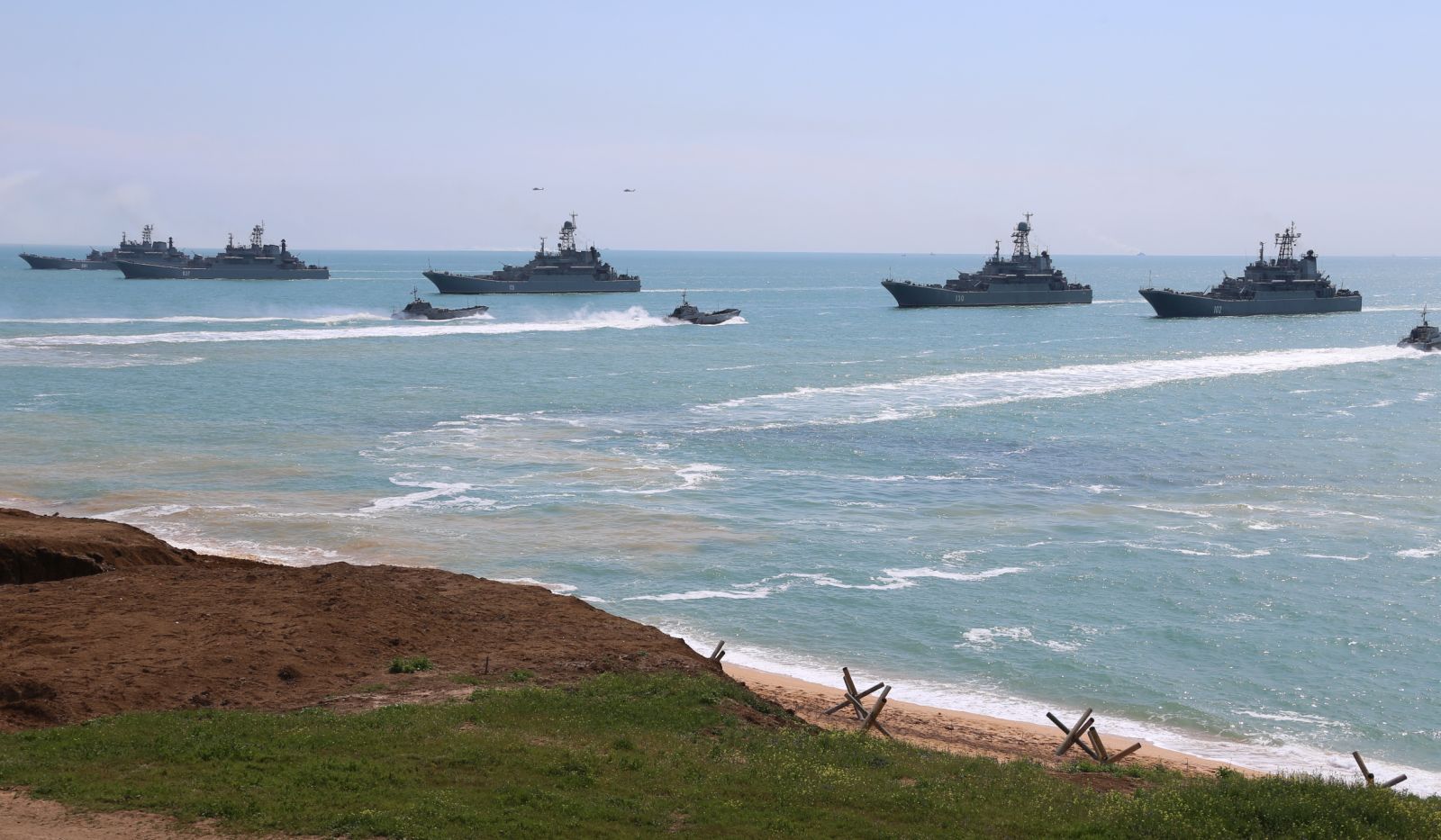 epa09152959 A handout photo made available by the press service of the Russian Defence Ministry shows Russian Navy large landing ships during the main stage of the mixed exercise of the Russian Armed Forces at the at Opuk range  in Crimea, 22 April 2021. Units of the combined arms army, air force and air defen–e formations, warships and ships, military units of the coastal forces of the Black Sea Fleet, part of the forces of the Caspian Flotilla and airborne units take part in the military exercises at the Opuk training ground.  EPA/VADIM SAVITSKY / RUSSIAN DEFENCE MINISTRY / HANDOUT MANDATORY CREDIT / HANDOUT EDITORIAL USE ONLY/NO SALES