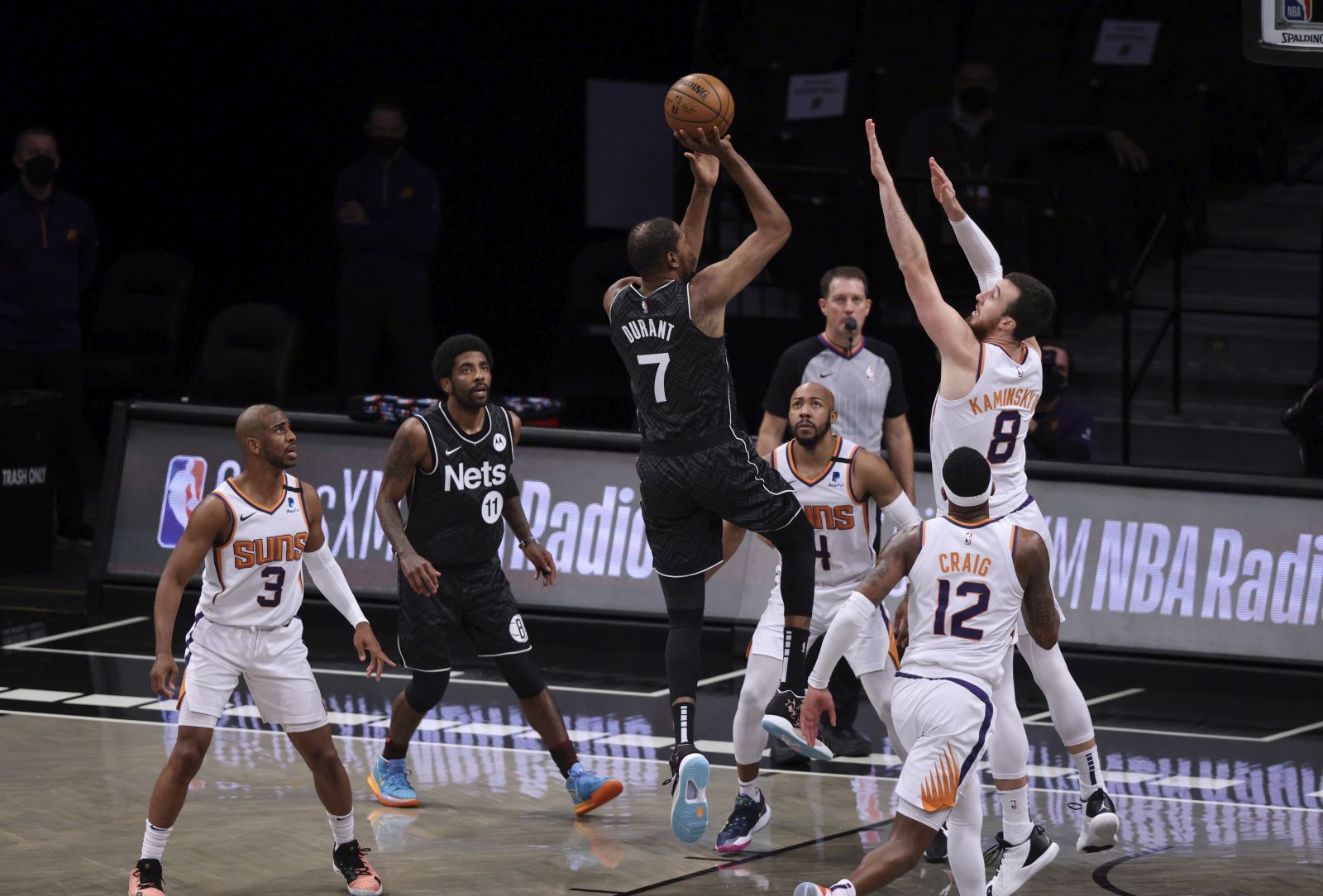 epa09159495 The Nets' Kevin Durant (3-L) shoots as the Suns' (L-R) Chris Paul, Jevon Carter, Torrey Craig and Frank Kaminsky defend and teammate Kyrie Irving (2-L) looks on during the first half of the game between the Phoenix Suns and the Brooklyn Nets at the Barclays Center in Brooklyn borough of New York, New York, USA, 25 April 2021.  EPA/JUSTIN LANE  SHUTTERSTOCK OUT