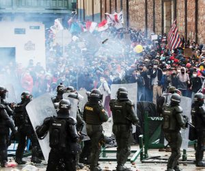 epa09166006 Protesters clash with Colombian Police during a protest in the Plaza de Bolivar in Bogota, Colombia 28 April 2021. Unions and social organizations took to the streets of Bogota and other cities in Colombia to express their rejection of the tax reform bill presented to Congress by the Government, which increases the tax burden mainly on the middle class.  EPA/Carlos Ortega