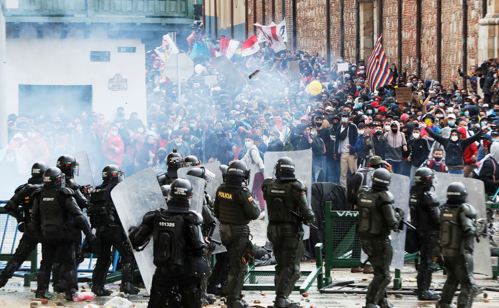 epa09166006 Protesters clash with Colombian Police during a protest in the Plaza de Bolivar in Bogota, Colombia 28 April 2021. Unions and social organizations took to the streets of Bogota and other cities in Colombia to express their rejection of the tax reform bill presented to Congress by the Government, which increases the tax burden mainly on the middle class.  EPA/Carlos Ortega