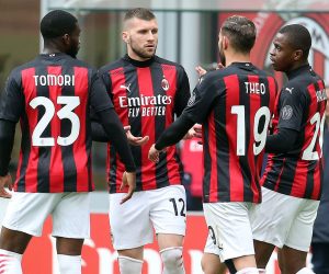 epa09142762 AC Milan’s Ante Rebic (2-L) celebrates with his teammates after scoring the 1-0 goal during the Italian serie A soccer match between AC Milan and Genoa CFC at Giuseppe Meazza stadium in Milan, Italy, 18  April 2021.  EPA/MATTEO BAZZI