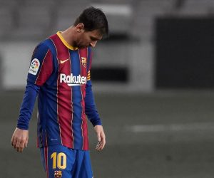 epa09168416 Barcelona's Argentinean striker Lionel Messi (L) reacts after his team concedes the second goal during the LaLiga match between Barcelona and Granada in Nou Camp stadium, Barcelona, Spain, 29 April 2021.  EPA/Alejandro Garcia