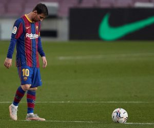 epa09168416 Barcelona's Argentinean striker Lionel Messi (L) reacts after his team concedes the second goal during the LaLiga match between Barcelona and Granada in Nou Camp stadium, Barcelona, Spain, 29 April 2021.  EPA/Alejandro Garcia