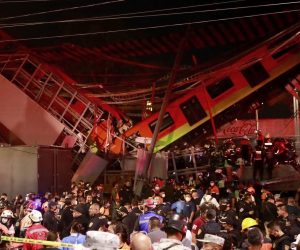 epa09176552 Aftermath of a metro overpass collapse in Mexico City, Mexico, 03 May 2021. At least 15 people died and another 70 were injured when a bridge on the elevated track of line 12 of the Mexico City Metro between Olivos and Tezonco station collapsed.  EPA/Carlos Ramirez