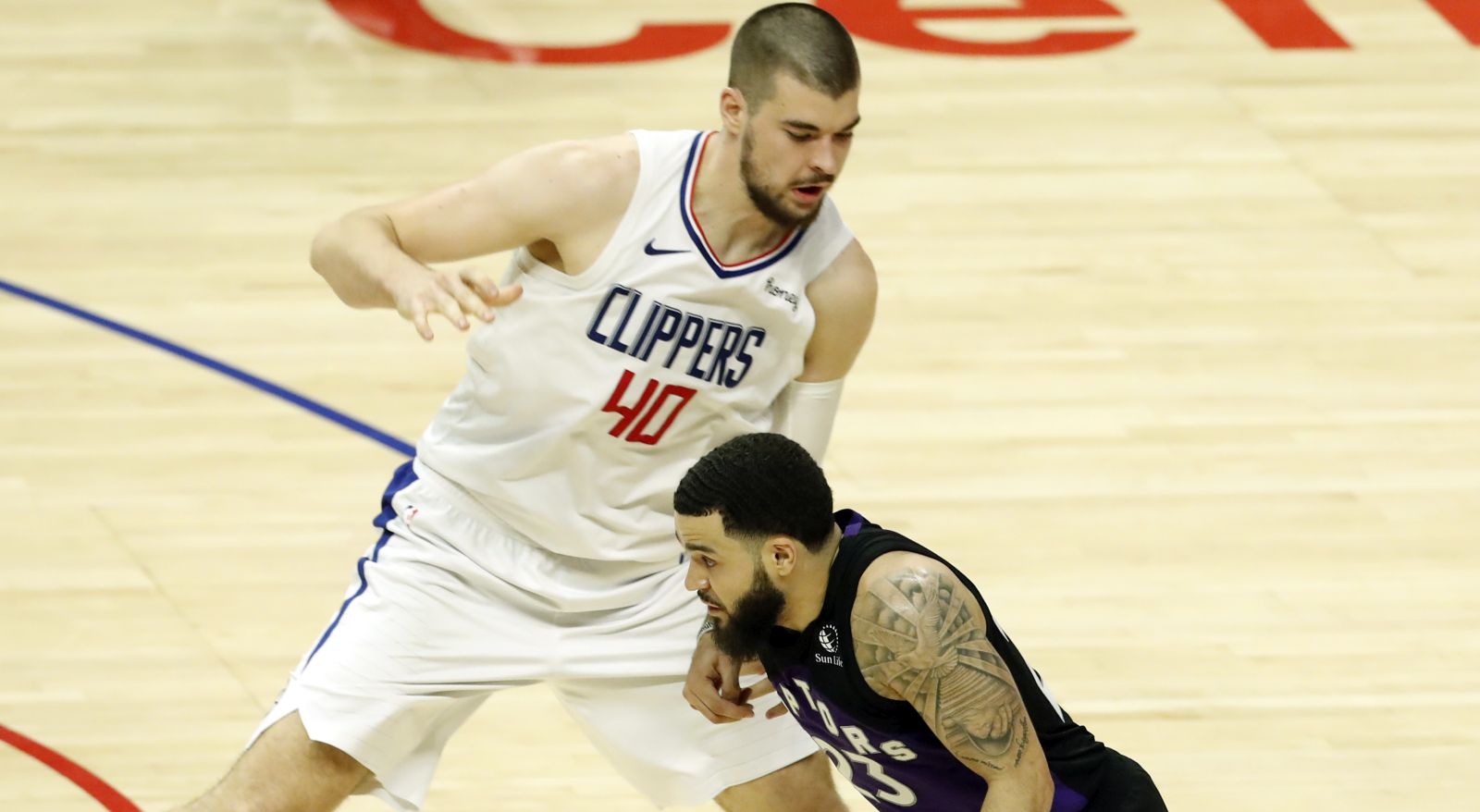 epa09178348 Toronto Raptors guard Fred VanVleet (R) in action against LA Clippers center Ivica Zubac during the fourth quarter of the NBA game between the Toronto Raptors and the Los Angeles Clippers at the Staples Center in Los Angeles, California, USA, 04 May 2021.  EPA/ETIENNE LAURENT SHUTTERSTOCK OUT