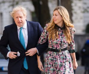 epa09180225 Britain's Prime Minster Boris Johnson (L) and his partner Carrie Symonds arrive at a polling station to cast their votes for the local elections in London, Britain, 06 May 2021. Britons go to the polls on 06 May 2021 to vote in local and mayoral elections.  EPA/VICKIE FLORES