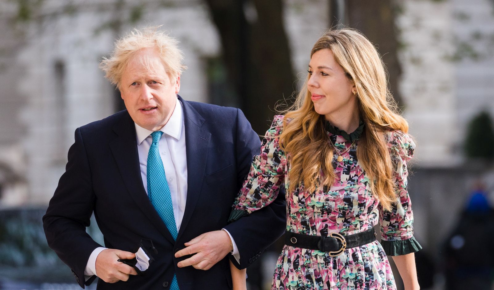 epa09180225 Britain's Prime Minster Boris Johnson (L) and his partner Carrie Symonds arrive at a polling station to cast their votes for the local elections in London, Britain, 06 May 2021. Britons go to the polls on 06 May 2021 to vote in local and mayoral elections.  EPA/VICKIE FLORES