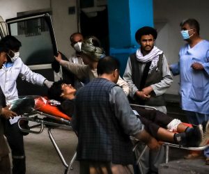 epa09185329 People carry an injured man into a hospital after an explosion in downtown Kabul, Afghanistan, 08 May 2021. An explosion near a school in Dasht-e-Barchi area west of Kabul killed at least 25 People and left dozens  wounded, according to the Ministry of Interior.  EPA/HEDAYATULLAH AMID