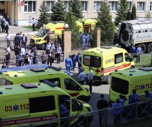 epa09190826 Ambulances and police cars gather outside a school in the aftermath of a shooting, in Kazan, Russia, 11 May 2011. The state news media reported that at least 11 people were killed in the shooting at the school.  EPA/Anton Raykhshtat