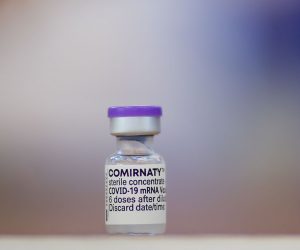 epa09191347 A vial of Pfizer-BioNTech COVID-19 vaccine is pictured at a vaccination center in Pristina, Kosovo, 11 May 2021. The European Commission and Austria announced on 20 April that a total of 651,000 doses of Pfizer-BoiNTech vaccines will be delivered to the Western Balkan region, on a weekly basis, from early May to August. Of these, 95,000 vaccines are dedicated for Kosovo.  EPA/VALDRIN XHEMAJ