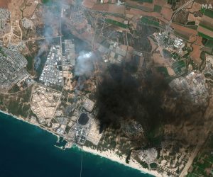epa09198390 A handout satellite image made available by MAXAR Technologies shows an overview of Ashkelon and a burning storage tank in Southern Israel, 12 May 2021 (issued 13 May 2021). In response to days of violent confrontations between Israeli security forces and Palestinians in Jerusalem, various Palestinian militants factions in Gaza launched rocket attacks since 10 May that killed at least seven Israelis to date. Gaza Strip's health ministry said that at least 100 Palestinians, including 13 children, were killed in the recent retaliatory Israeli airstrikes. Hamas confirmed the death of Bassem Issa, its Gaza City commander, during an airstrike.  EPA/MAXAR TECHNOLOGIES HANDOUT -- MANDATORY CREDIT: SATELLITE IMAGE 2021 MAXAR TECHNOLOGIES -- the watermark may not be removed/cropped -- HANDOUT EDITORIAL USE ONLY/NO SALES