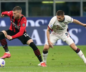 epa09205502 AC Milan’s Ante Rebic (L) challenges for the ball with Cagliari’s Razvan Marin during the Italian serie A soccer match between AC Milan and Cagliari at Giuseppe Meazza stadium in Milan, Italy, 16 May 2021.  EPA/MATTEO BAZZI