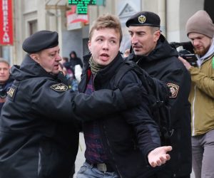 epa09223072 (FILE) Police officers detain a journalist Roman Protasevich attempting to cover a rally in Minsk, Belarus, 26 March 2017 (reissued 23 May 2021). A Ryanair flight from Athens, Greece to Vilnius, Lithuania, with Belarus' opposition journalist Roman Protasevich onboard, has been diverted and forced to land in Minsk on 23 May 2021, after alleged bomb threat. Protasevich was detained by Belarusian Police after landing, as Belarusian Human Rights Center 'Viasna' reports and Lithuanian President Gitanas Nauseda demanded immediate release of Protasevich.  EPA/STRINGER *** Local Caption *** 53411871