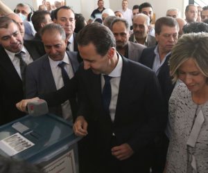 epa09228306 Syrian President Bashar al-Assad and his wife Asma cast their votes for the presidential election at a polling station in Duma city, outskirts of Damascus, Syria, on 26 May 2021. The city was liberated by the Syrian army in 2018 after driving rebels out. Syrians will choose one out of three candidates, including Assad, for the post of President of the Syrian Arab Republic. The number of eligible voters registered inside and outside Syria has reached more than 18 million.  EPA/YOUSSEF BADAWI