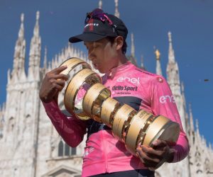 epa09237441 Colombian rider Egan Bernal of the Ineos Grenadiers team kisses the trophy after winning the overall classification of the 2021 Giro d'Italia cycling race following the 21st stage, an individual time trial over 30.3km from Senago to Milan, Italy, 30 May 2021.  EPA/LUCA ZENNARO