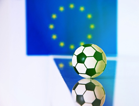 Soccer ball with the European flag as background concept of Euro 2020