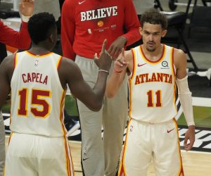 Atlanta Hawks' Trae Young and Clint Capela celebrate after Game 1 of the NBA Eastern Conference basketball finals game against the Milwaukee Bucks Wednesday, June 23, 2021, in Milwaukee. The Hawks won 116-113 to take a 1-0 lead in the series. (AP Photo/Morry Gash)