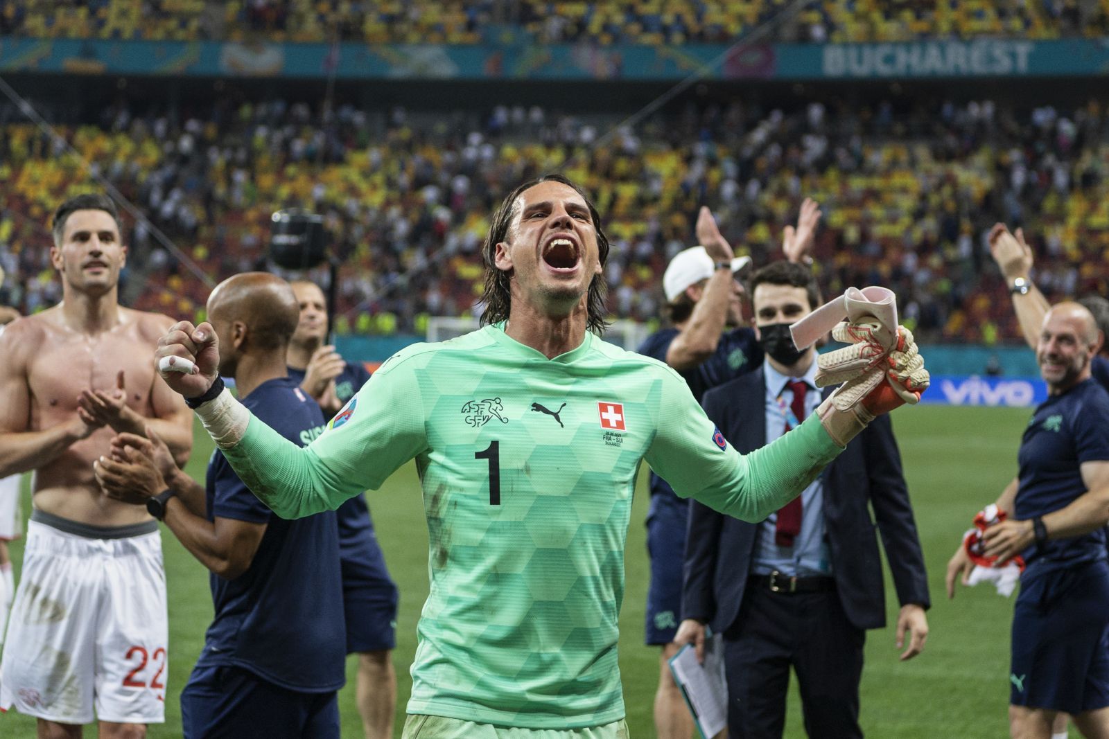 Switzerland's goalkeeper Yann Sommer celebrates after a penalty shootout at the end of the Euro 2020 soccer championship round of 16 match between France and Switzerland at the National Arena stadium, in Bucharest, Romania, Monday, June 28, 2021. Switzerland won on penalties after the match ended 3-3. (Jean-Christophe Bott/Keystone via AP)