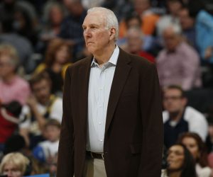 San Antonio Spurs head coach Greg Popovich looks on against the Denver Nuggets in the third quarter of the Spurs' 133-102 victory in an NBA basketball game in Denver on Friday, March 28, 2014. (AP Photo/David Zalubowski)
