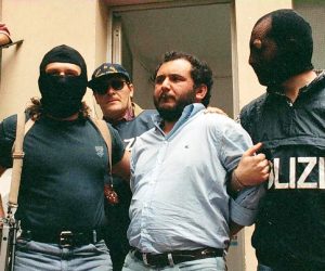 epa09241057 (FILE) - Giovanni Brusca (C) is led off by police following his interrogation in Palermo, Sicily, Italy, 21 May 1996 (issued 01 June 2021). Brusca, 64, was released from Rome's Rebibbia prison on 31 June 2021 after 25 years in jail, having served all but 45 days of his sentence. Brusca was arrested in May 1996 and sentenced to life for over 100 murders, including that of anti-Mafia prosecutor Giovanni Falcone, his wife Francesca Morvillo and three police officers in May 1992.  EPA/LANNINO BEST QUALITY AVAILABLE