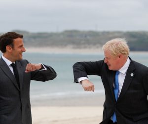 epa09262128 Britain's Prime Minister Boris Johnson (R) greets France's President Emmanuel Macron (L) as they arrive for the G7 summit in Carbis Bay, Cornwall, Britain, 11 June 2021.  EPA/PHIL NOBLE / POOL