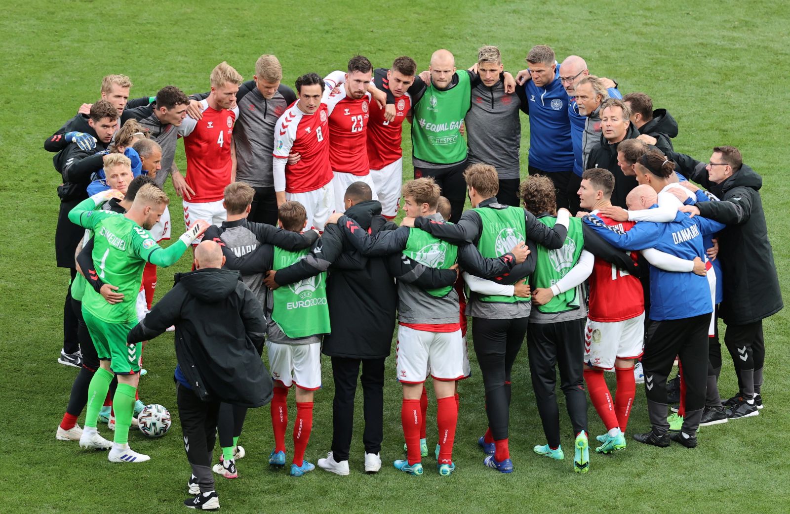 epa09265692 Players of Denmark come together prior to the restart of the UEFA EURO 2020 group B preliminary round soccer match between Denmark and Finland in Copenhagen, Denmark, 12 June 2021.  EPA/Wolfgang Rattay / POOL (RESTRICTIONS: For editorial news reporting purposes only. Images must appear as still images and must not emulate match action video footage. Photographs published in online publications shall have an interval of at least 20 seconds between the posting.)