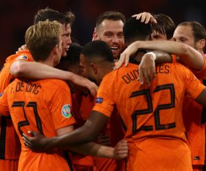 epa09268927 Wout Weghorst (L) of the Netherlands celebrates with teammates after scoring his team's second goal during the UEFA EURO 2020 preliminary round group C match between the Netherlands and Ukraine in Amsterdam, the Netherlands, 13 June 2021.  EPA/Dean Mouhtaropoulous / POOL (RESTRICTIONS: For editorial news reporting purposes only. Images must appear as still images and must not emulate match action video footage. Photographs published in online publications shall have an interval of at least 20 seconds between the posting.)