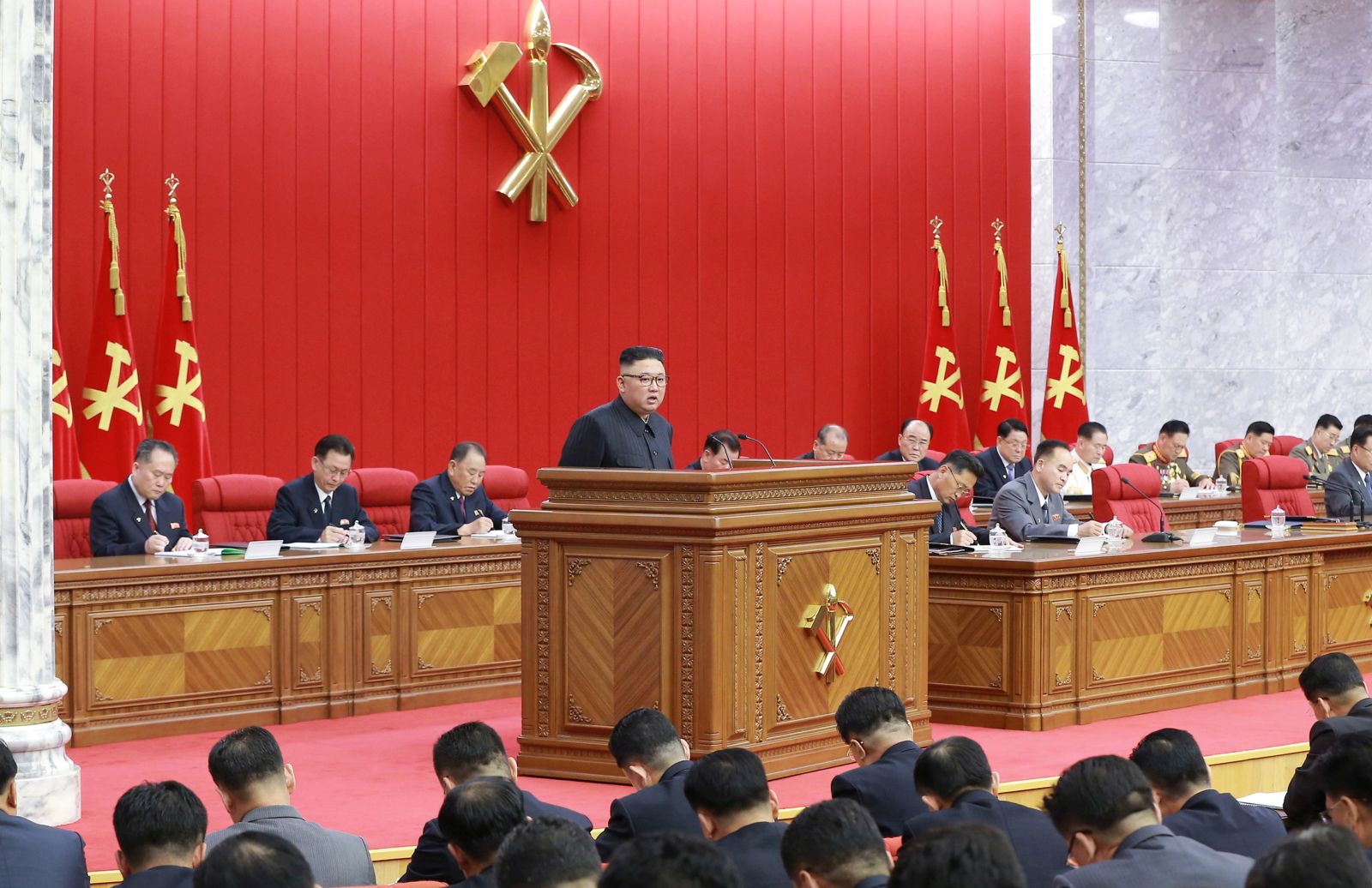epa09275007 A photo released by the official North Korean Central News Agency (KCNA) shows North Korean Supreme Leader Kim Jong-un (C) presiding over the opening of the third Plenary Meeting of the 8th Central Committee of the Workers' Party of Korea (WPK), amid unusual concern and expectations of all the Party members and all the people of the country keeping high fighting spirit braving manifold difficulties in their advance along the path indicated by the historic 8th Congress of the Party, in Pyongyang, North Korea, 15 June 2021 (issued 16 June 2021).  EPA/KCNA   EDITORIAL USE ONLY