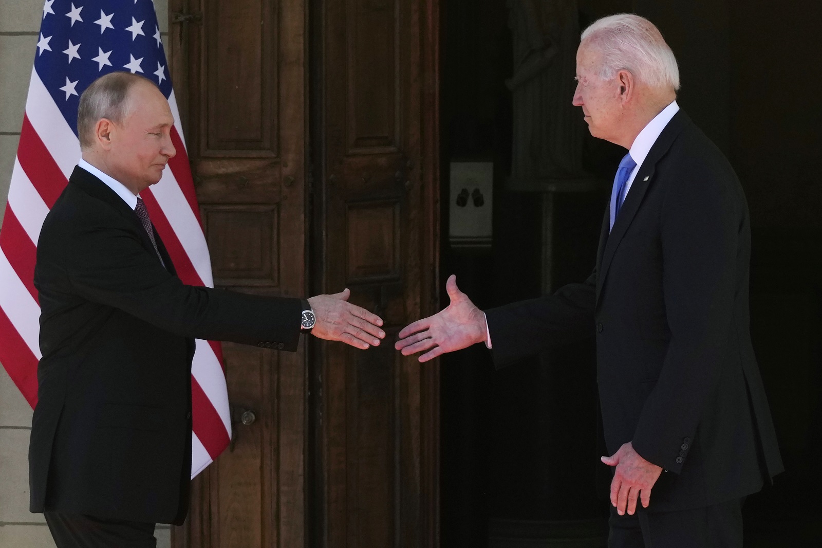 epa09275849 US President Joe Biden (R) and Russian President Vladimir Putin (L) shake hands during the US-Russia summit at the Villa La Grange, in Geneva, Switzerland, 16 June 2021.  EPA/ALEXANDER ZEMLIANICHENKO / POOL