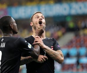 epa09276312 (FILE) - Marko Arnautovic (R) of Austria celebrates with team-mate David Alaba after scoring the third goal of his team during the UEFA EURO 2020 group C preliminary round soccer match between Austria and North Macedonia in Bucharest, Romania, 13 June 2021 (reissued 16 June 2021. The UEFA Appeals Body has announced on 16 June 2021 to suspend Arnautovic for the next game for insulting another player.  EPA/Robert Ghement / POOL (RESTRICTIONS: For editorial news reporting purposes only. Images must appear as still images and must not emulate match action video footage. Photographs published in online publications shall have an interval of at least 20 seconds between the posting.)